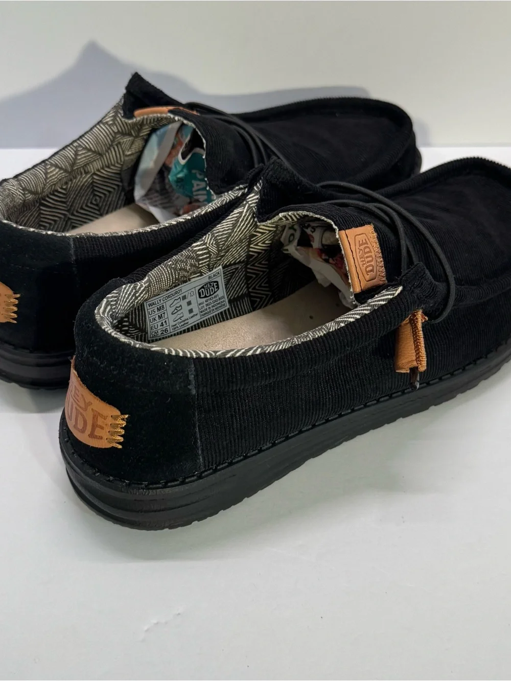 HEYDUDE Black Canvas Slip-On Loafers with Tan Accents